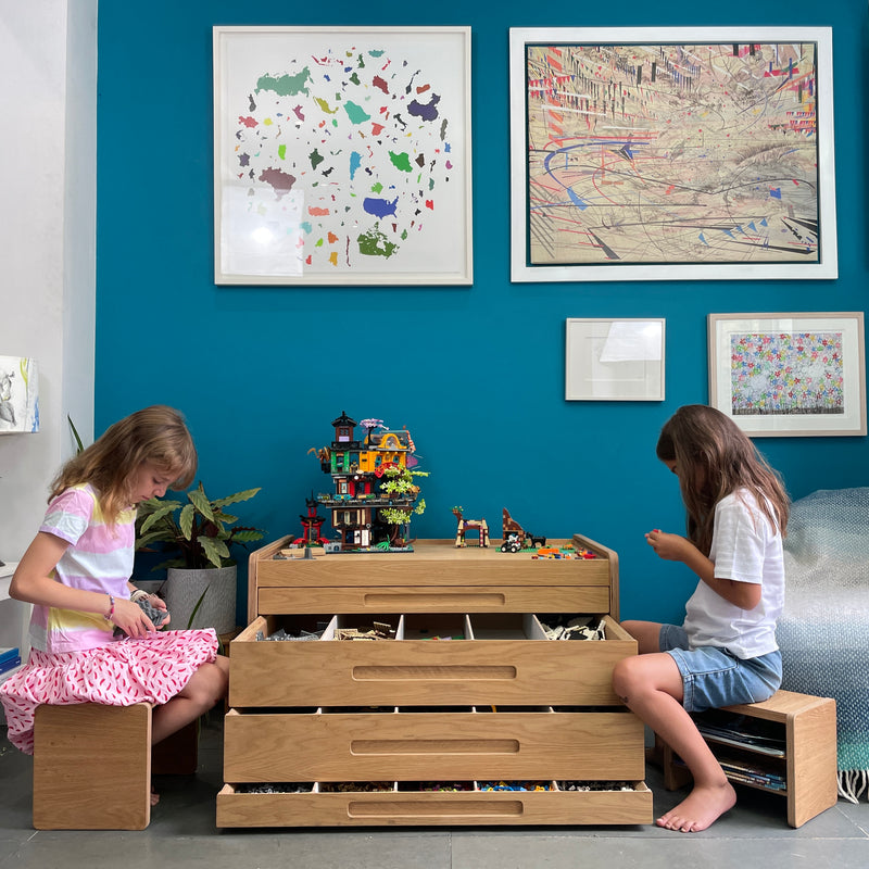 Children playing with LEGO pieces at Oak Brickle