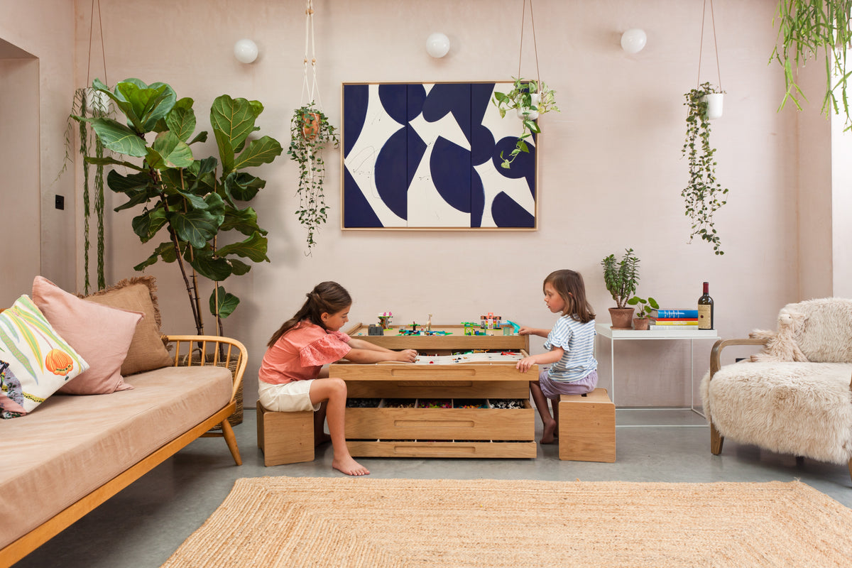 Two children playing with LEGO at an Oak Brickle