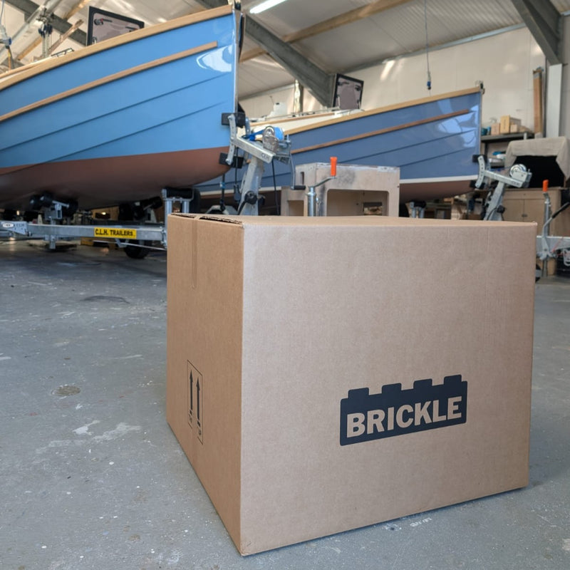 Brickle cardboard delivery Box in front of yachts